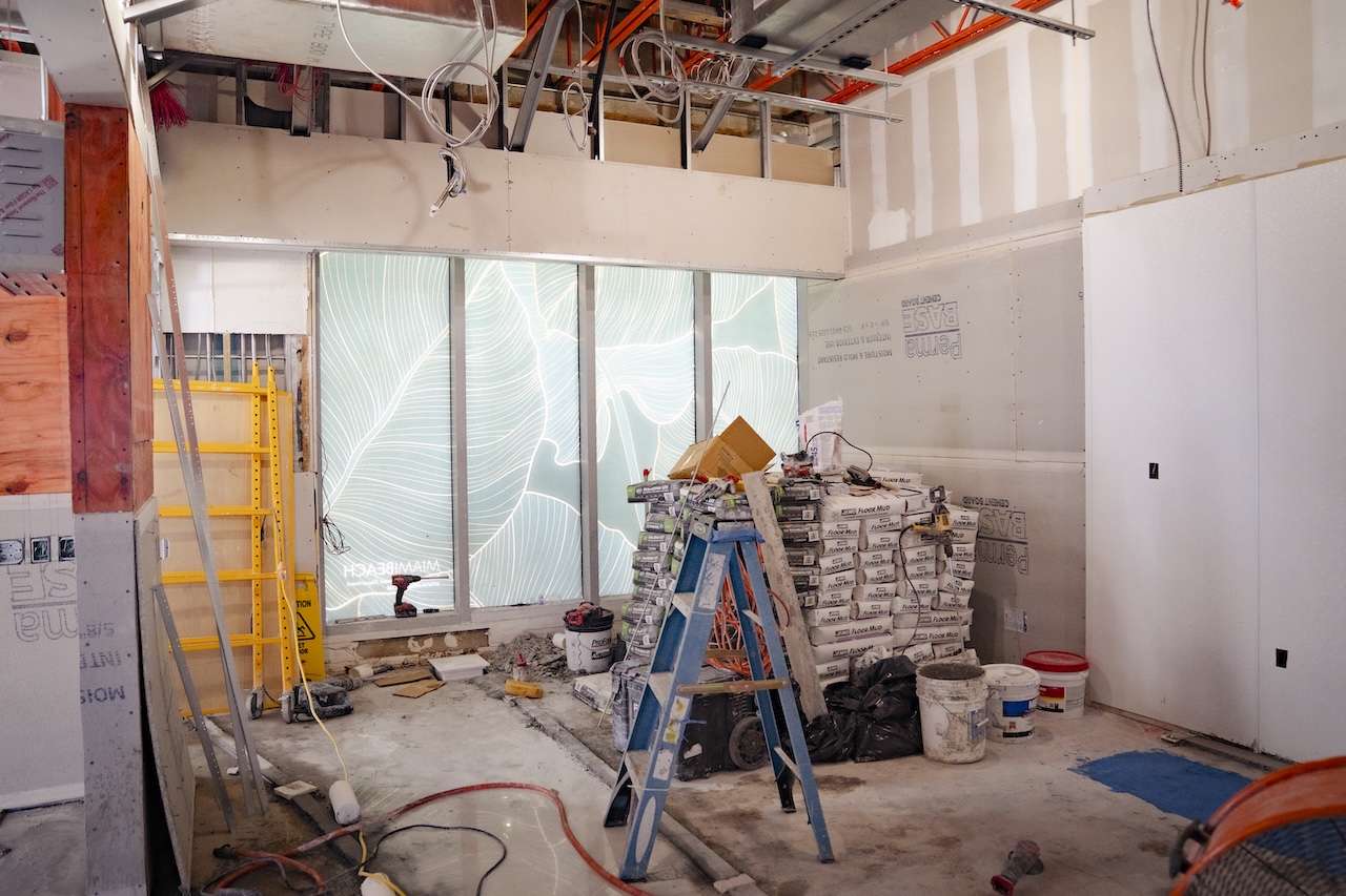 Commercial contractor reviewing floor plans in Miami