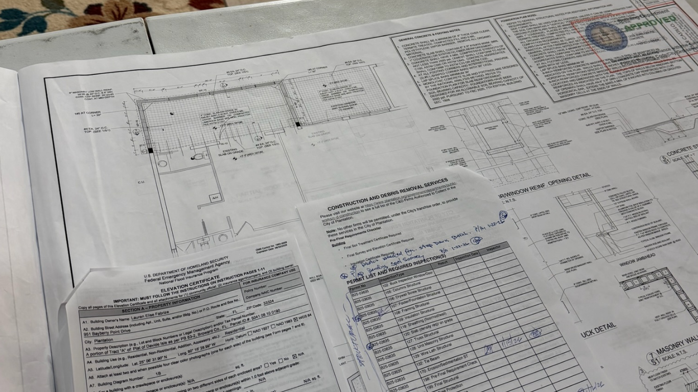Construction permit timeline — approved permit on site with framing visible in the background, Miami-Dade County